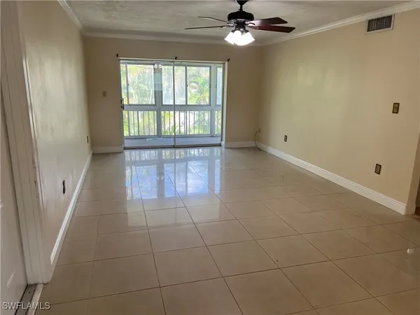 a view of an empty room with a window