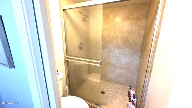 a bathroom with a bathtub and shower