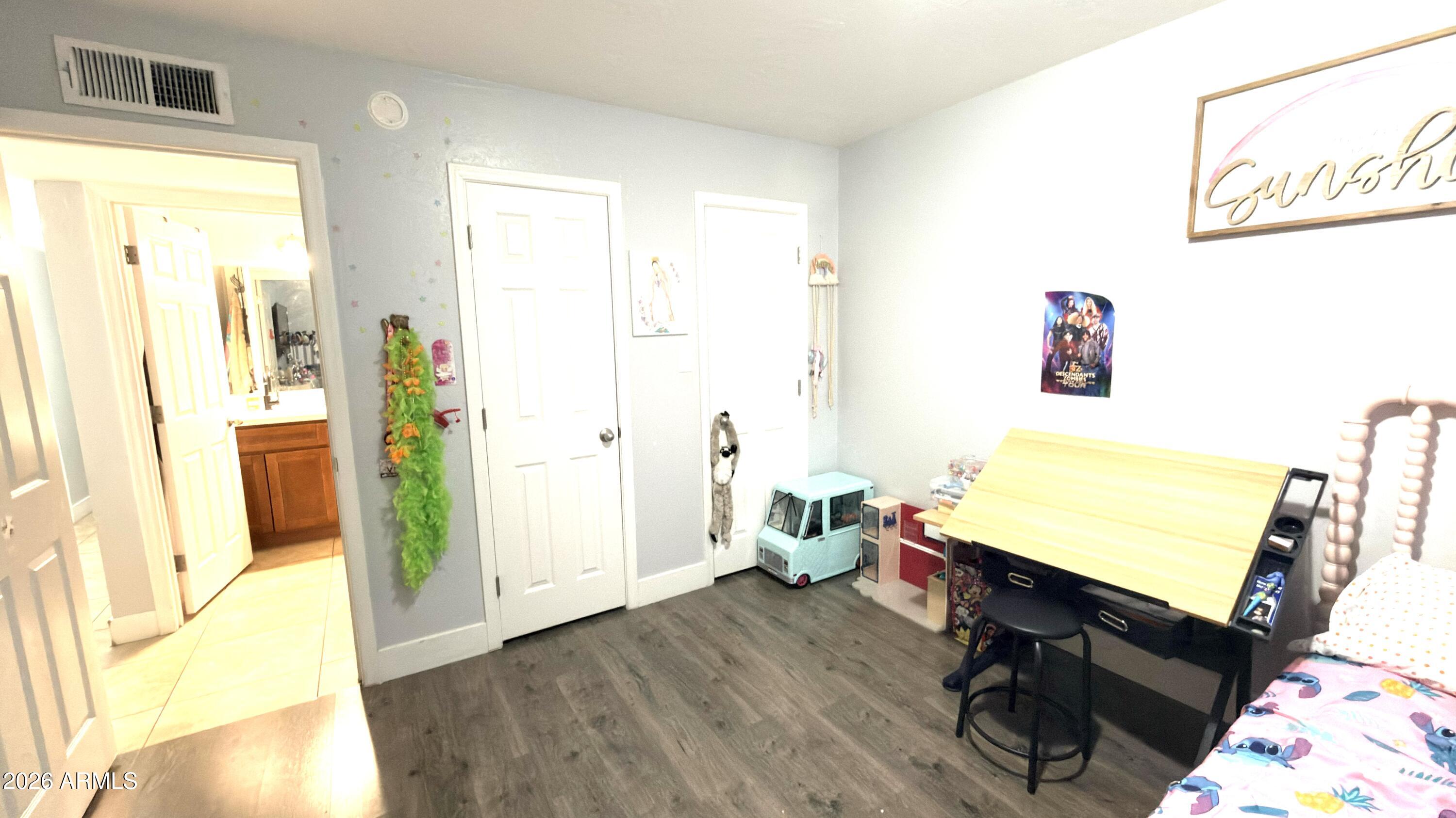 480 West Harrison Street Chandler, AZ 85225 - Photo 19 of 28 a room with furniture and a wooden floor