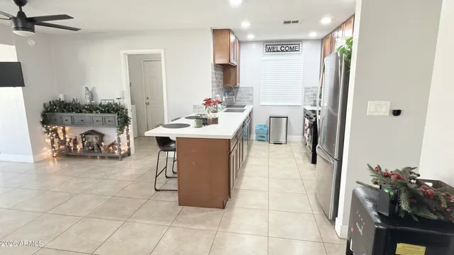 a kitchen with stainless steel appliances a refrigerator and a sink
