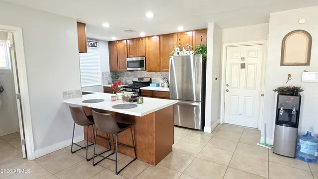 a living room with furniture and a mirror