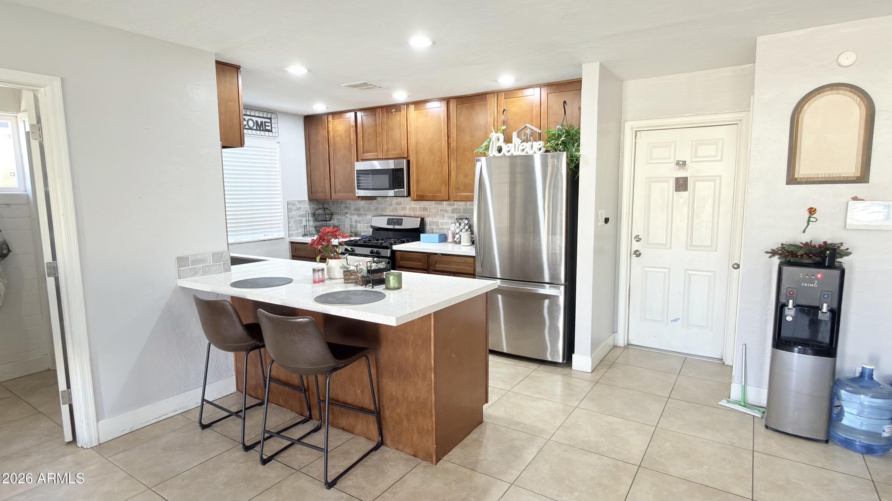 480 West Harrison Street Chandler, AZ 85225 - Photo 7 of 28 a kitchen with stainless steel appliances a refrigerator and a sink