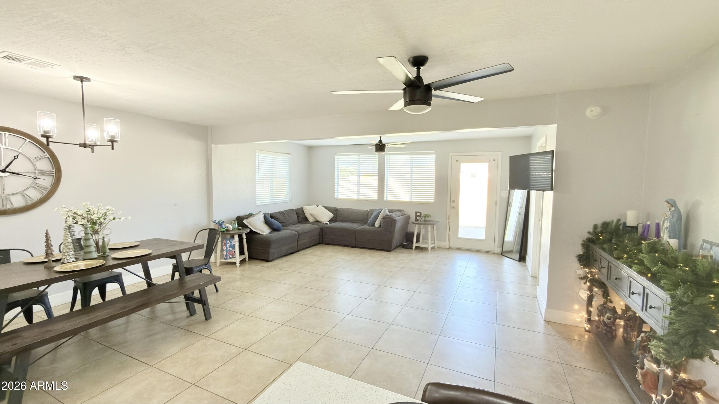 480 West Harrison Street Chandler, AZ 85225 - Photo 10 of 28 a living room with furniture and a chandelier