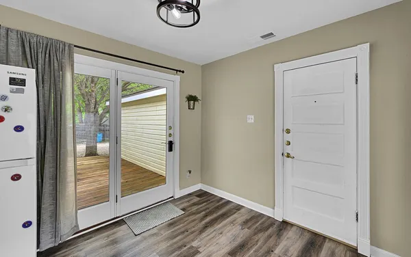 a view of a kitchen that has a sink and a window