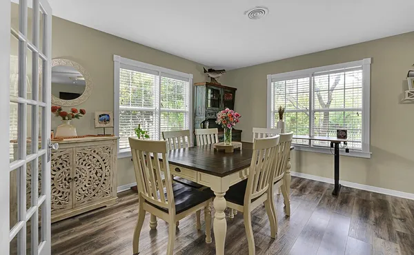 a dining room with furniture window wooden floor