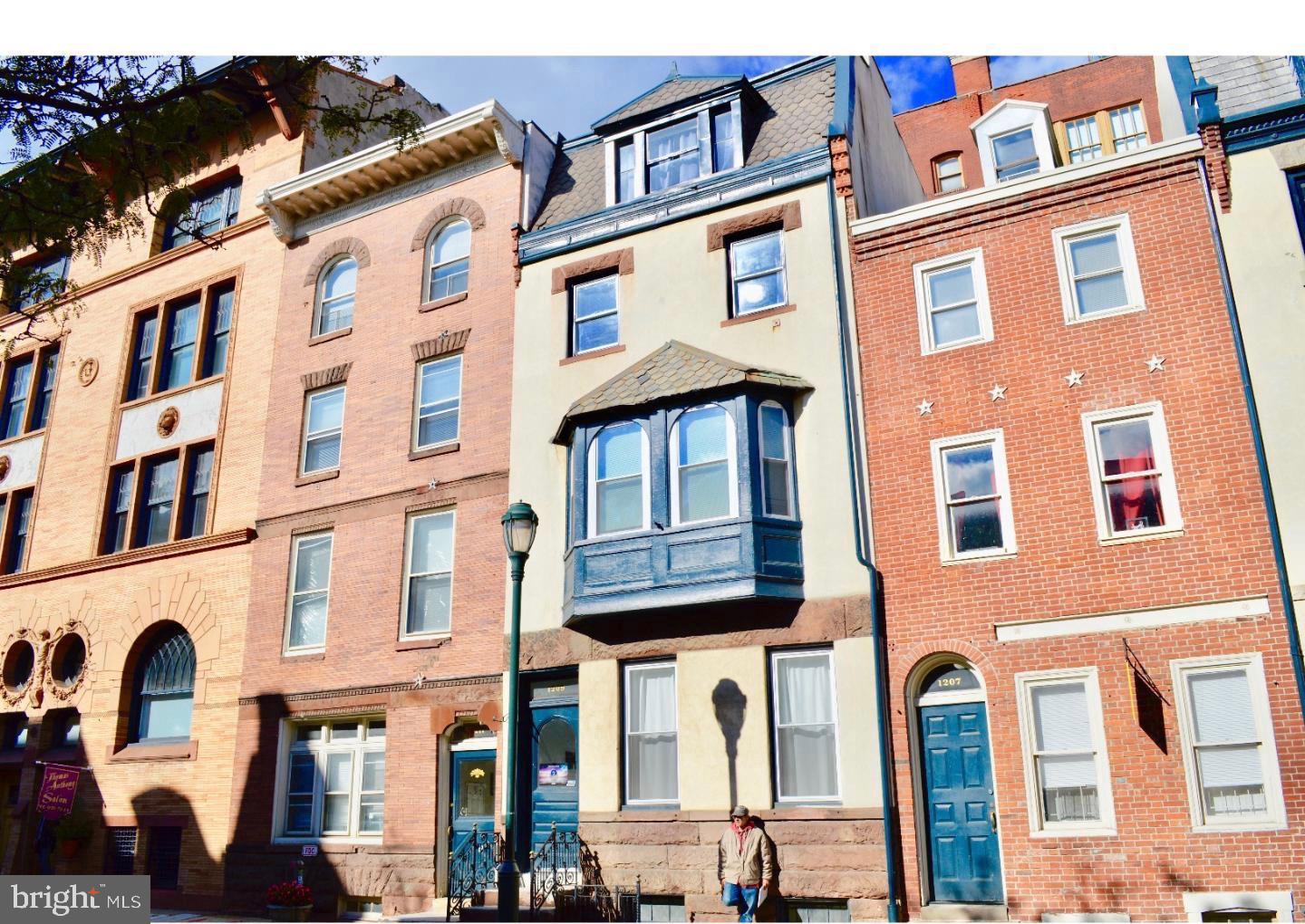 1207 Locust Street, Unit 2F Philadelphia, PA 19107 - Photo 1 of 19 a front view of a multi story residential apartment building