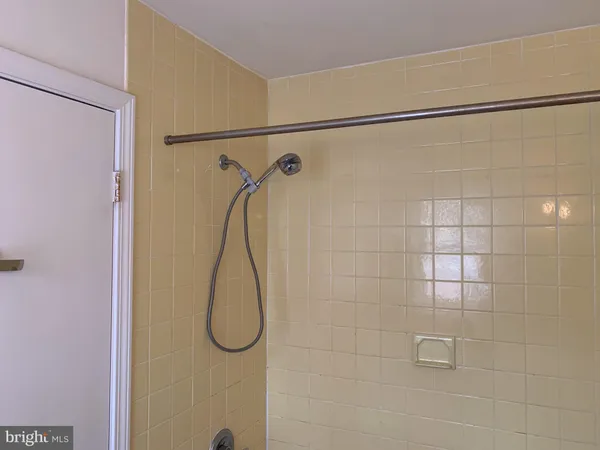 a bathroom that has a glass shower door