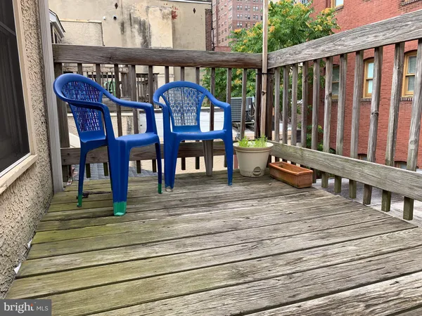 a view of a two chairs on the roof deck