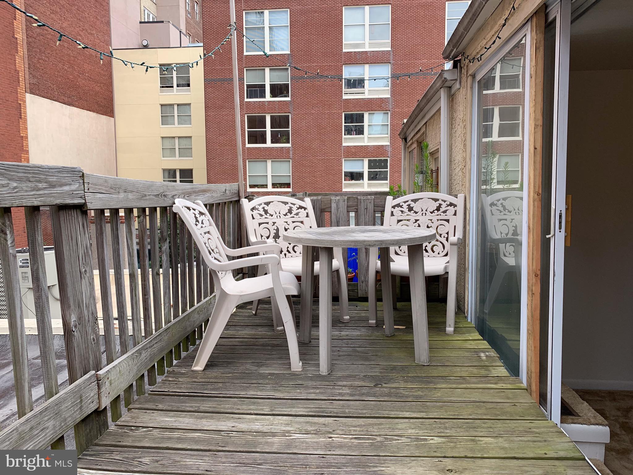 1207 Locust Street, Unit 2F Philadelphia, PA 19107 - Photo 15 of 19 a view of a chairs on the deck