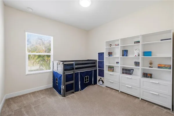 a room with furniture and white walls