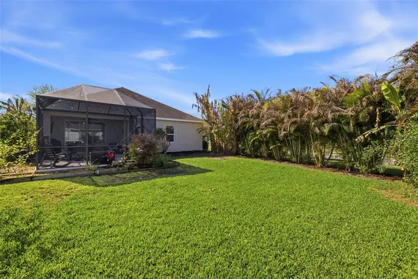 a view of a house with swimming pool garden and patio