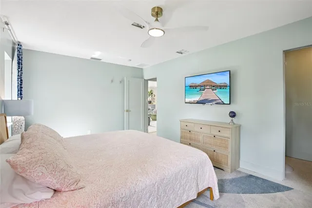 a bedroom with a bed and a dresser