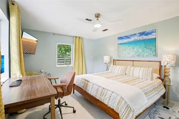 a bedroom with a bed and a table