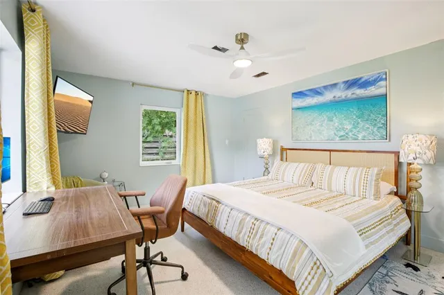 a bedroom with a bed and a table