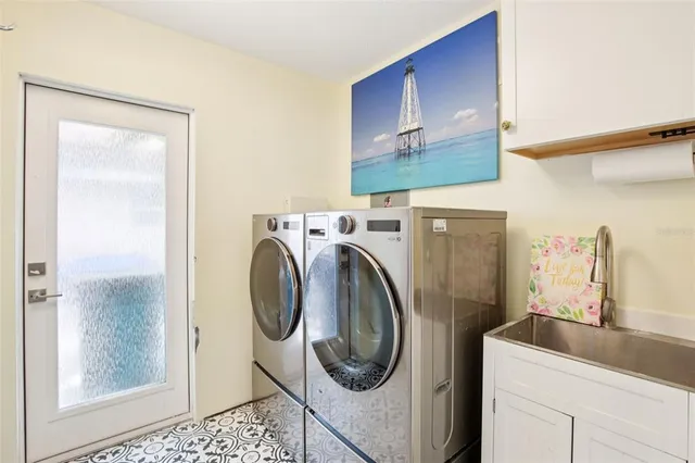 a utility room with dryer and washer