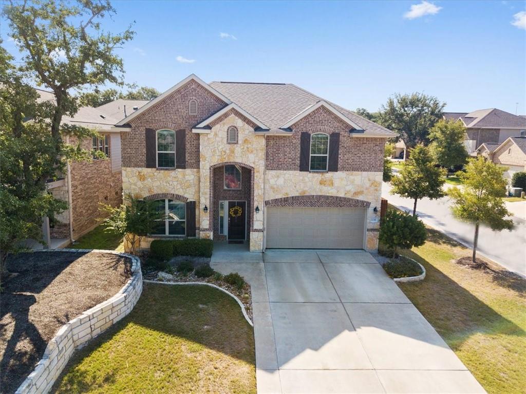 12311 Altamira Street Austin, TX 78748 - Photo 1 of 36 a front view of a house with garden