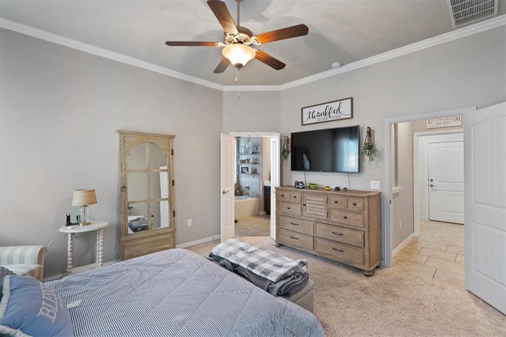 12311 Altamira Street Austin, TX 78748 - Photo 14 of 36 a living room with furniture and a flat screen tv