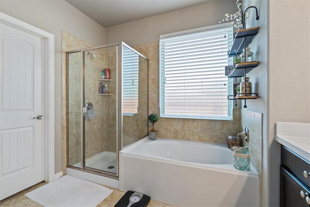 12311 Altamira Street Austin, TX 78748 - Photo 16 of 36 a white bath tub sitting next to a white sink
