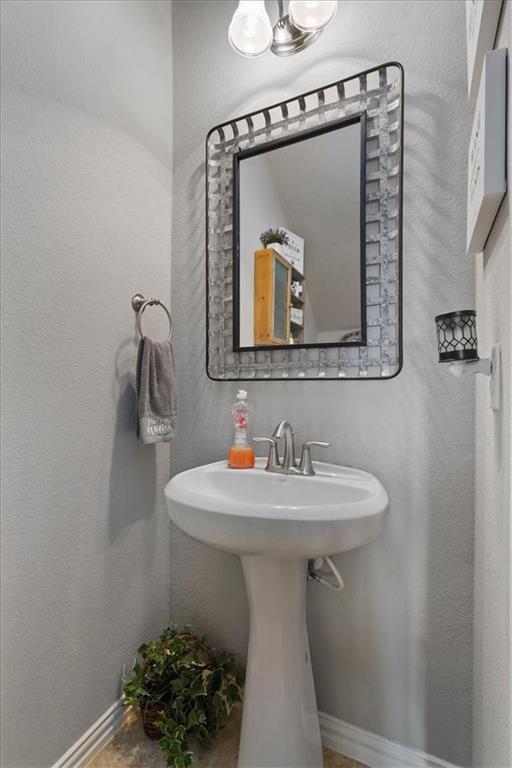 12311 Altamira Street Austin, TX 78748 - Photo 18 of 36 a bathroom with a sink and mirror