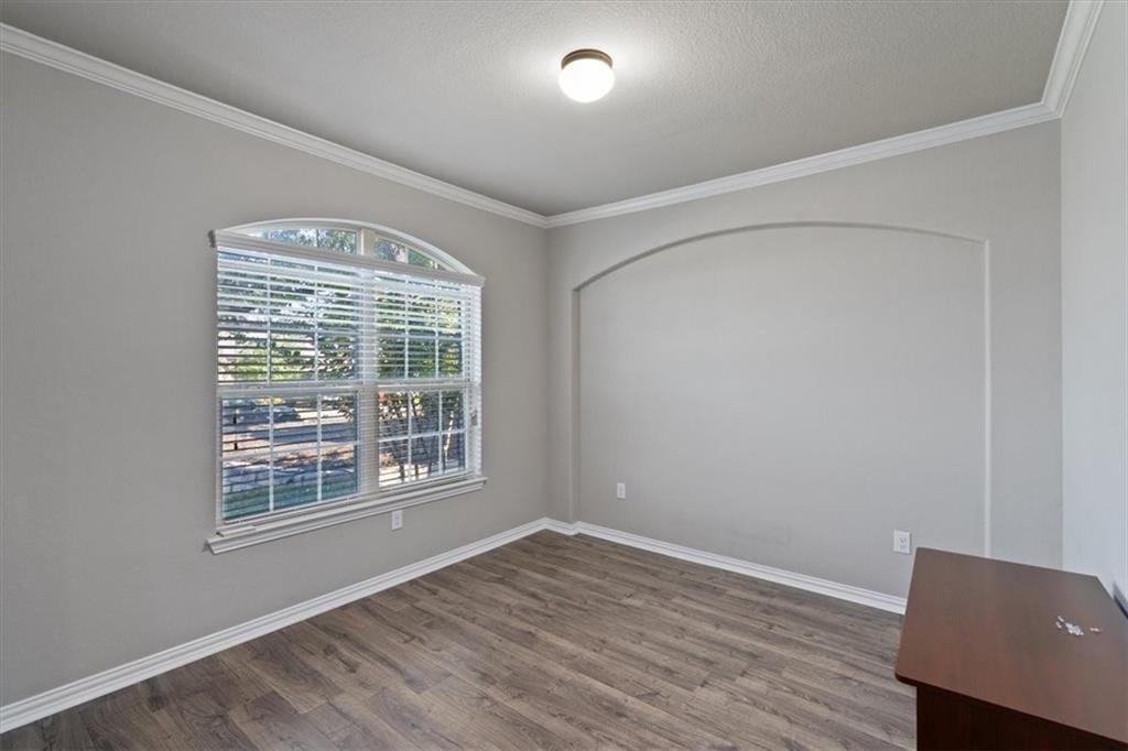 12311 Altamira Street Austin, TX 78748 - Photo 20 of 36 a view of an empty room with wooden floor and a window