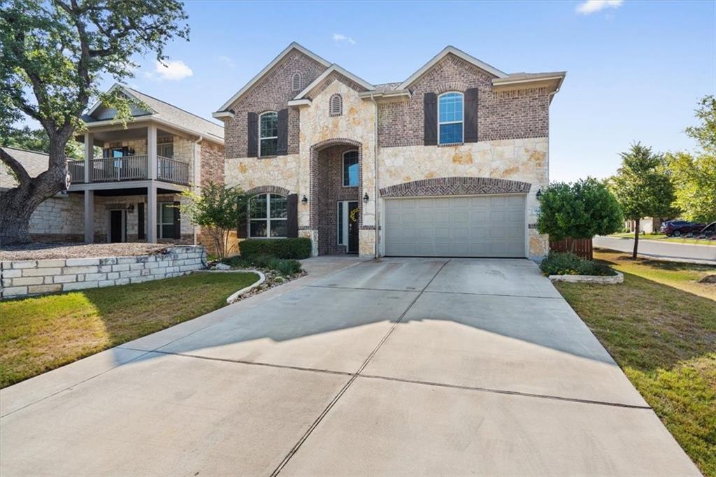 12311 Altamira Street Austin, TX 78748 - Photo 2 of 36 a front view of house with yard and trees in the background