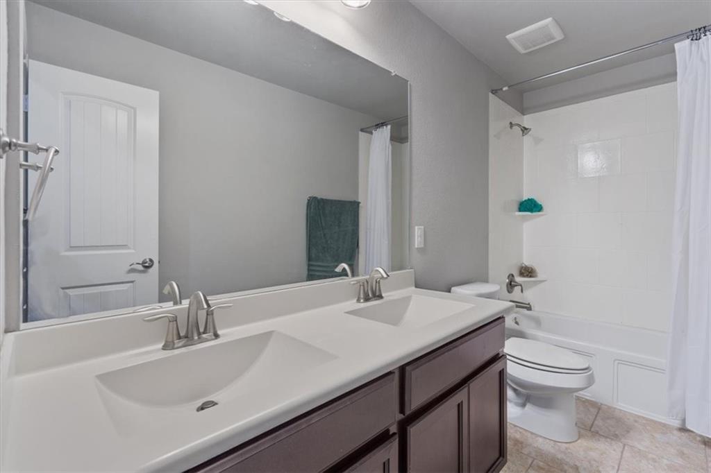 12311 Altamira Street Austin, TX 78748 - Photo 27 of 36 a bathroom with a sink toilet and shower