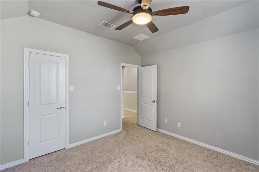 12311 Altamira Street Austin, TX 78748 - Photo 29 of 36 an empty room with closet and a chandelier fan