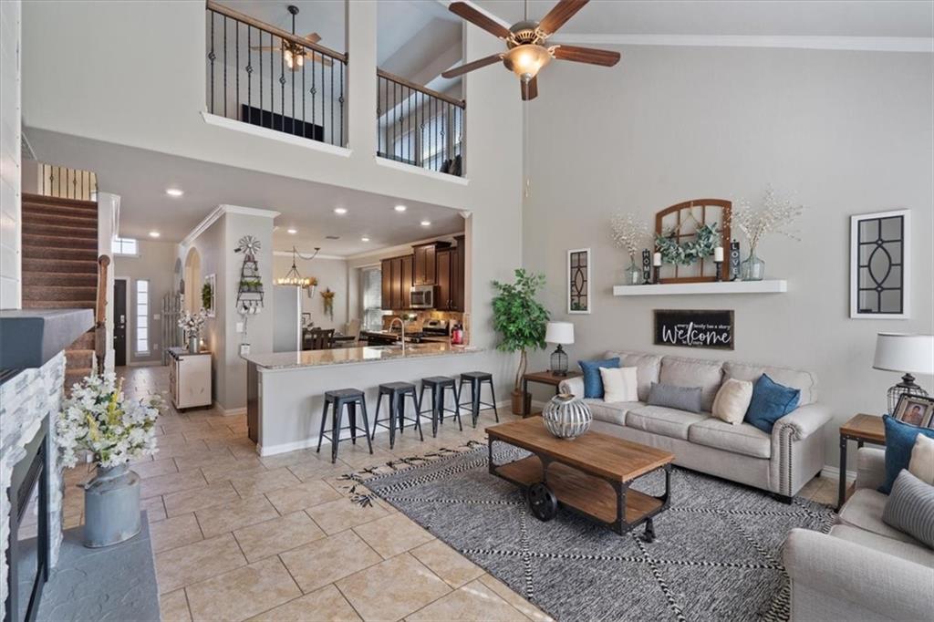 12311 Altamira Street Austin, TX 78748 - Photo 4 of 36 a living room with furniture and a view of kitchen living room