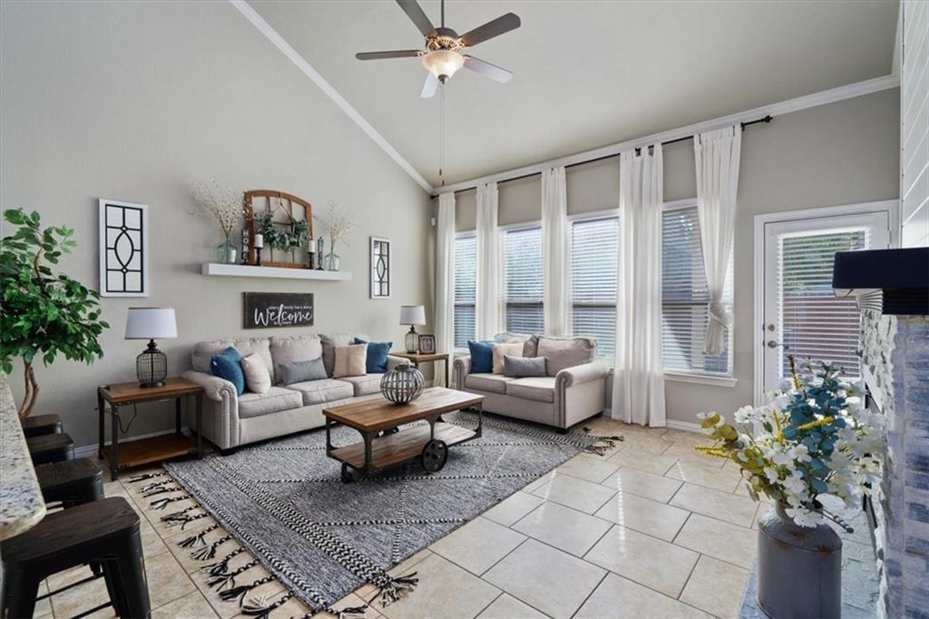 12311 Altamira Street Austin, TX 78748 - Photo 5 of 36 a living room with furniture flower pot and a fireplace