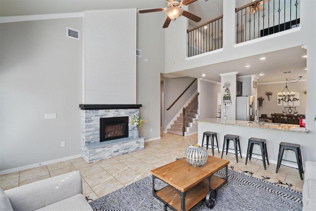 12311 Altamira Street Austin, TX 78748 - Photo 6 of 36 a living room with furniture and a fireplace