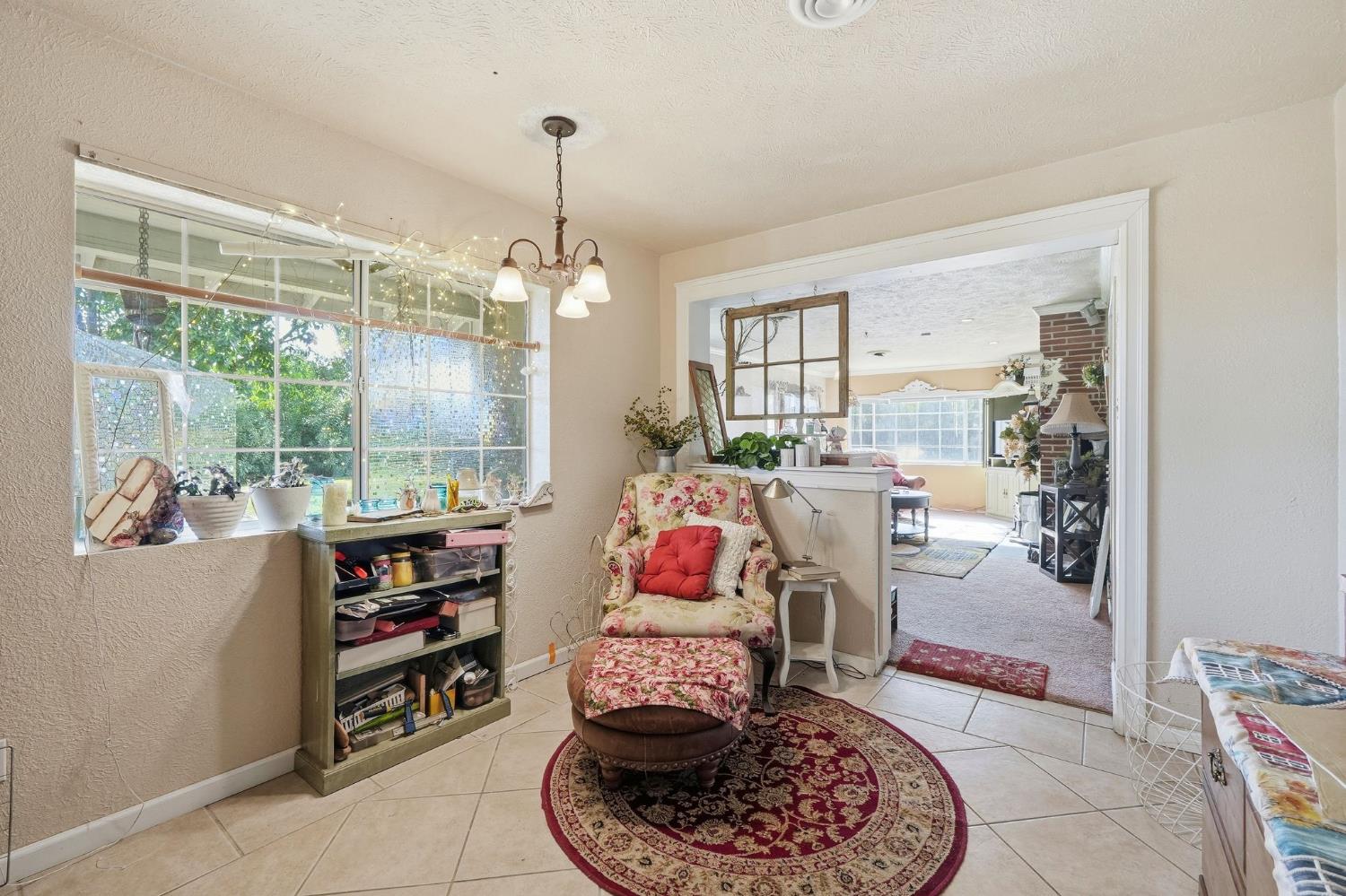 7801 El Modena Avenue Elverta, CA 95626 - Photo 14 of 51 a room with furniture and a chandelier