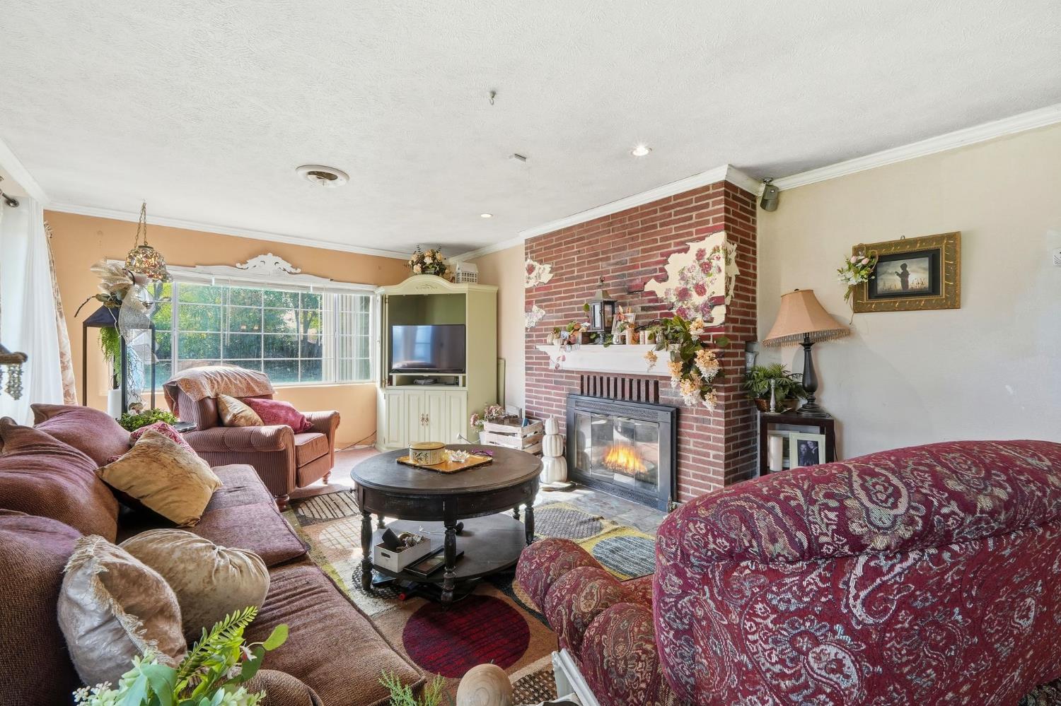 7801 El Modena Avenue Elverta, CA 95626 - Photo 16 of 51 a living room with furniture and a floor to ceiling window