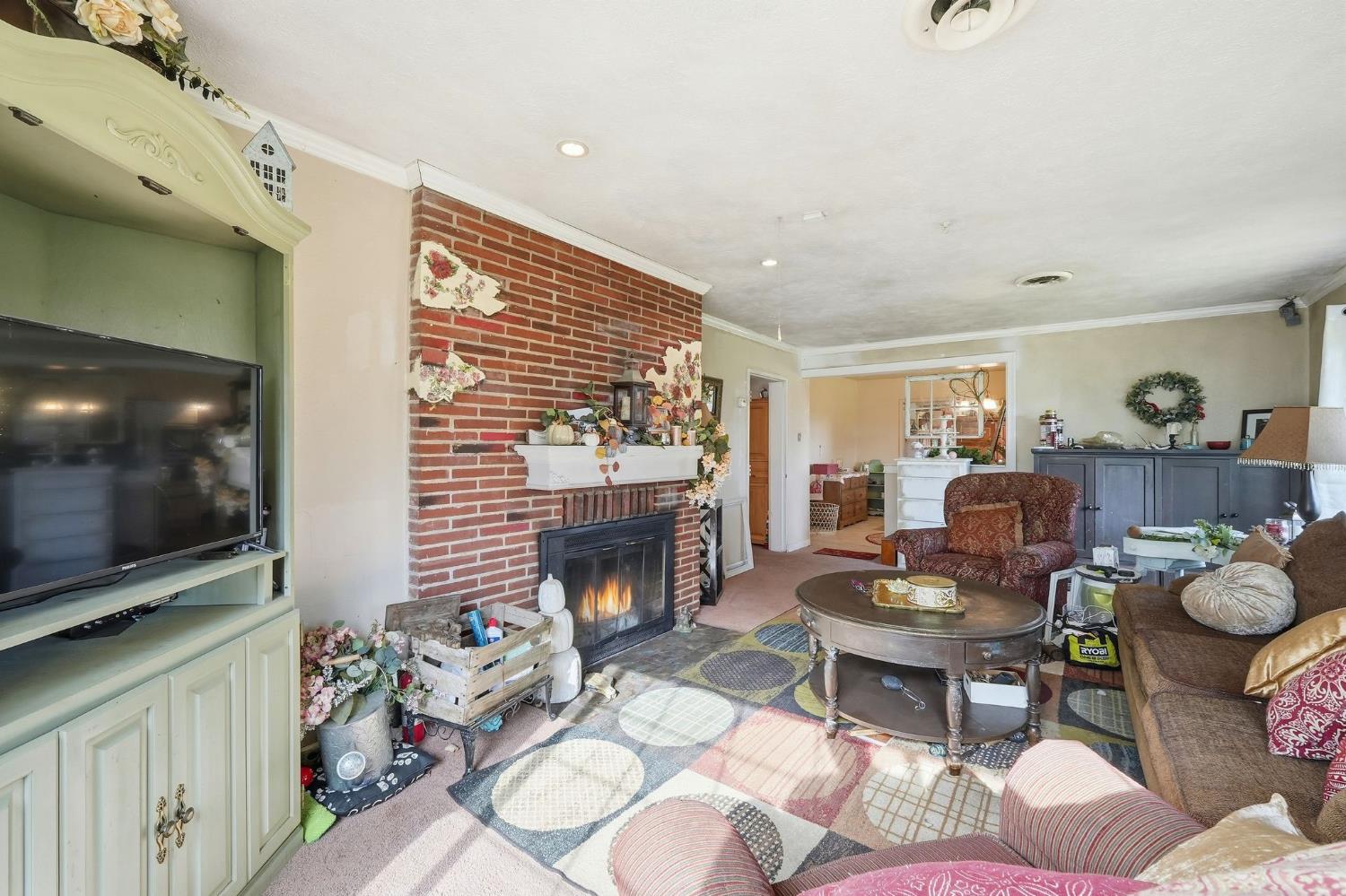 7801 El Modena Avenue Elverta, CA 95626 - Photo 18 of 51 a living room with furniture and a flat screen tv