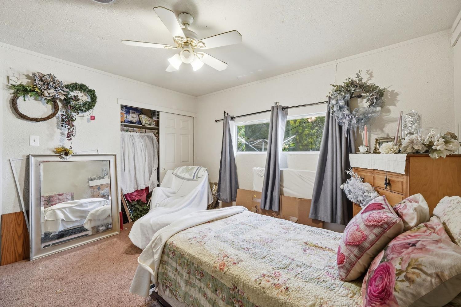 7801 El Modena Avenue Elverta, CA 95626 - Photo 20 of 51 a bedroom with a bed and a chandelier