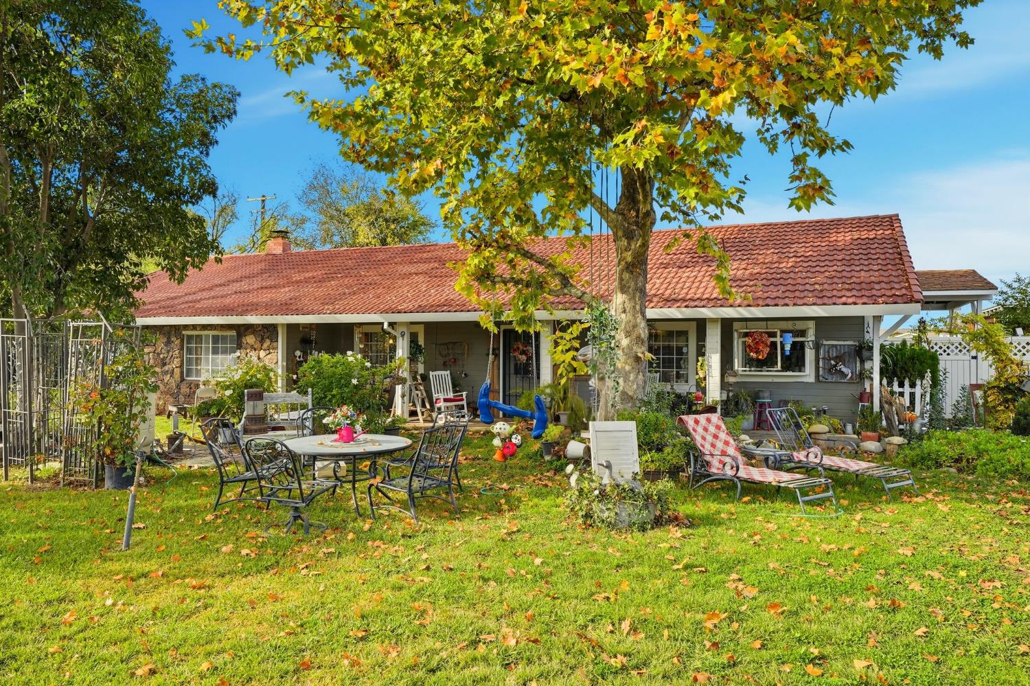 7801 El Modena Avenue Elverta, CA 95626 - Photo 2 of 51 a front view of a house with swimming pool and sitting area