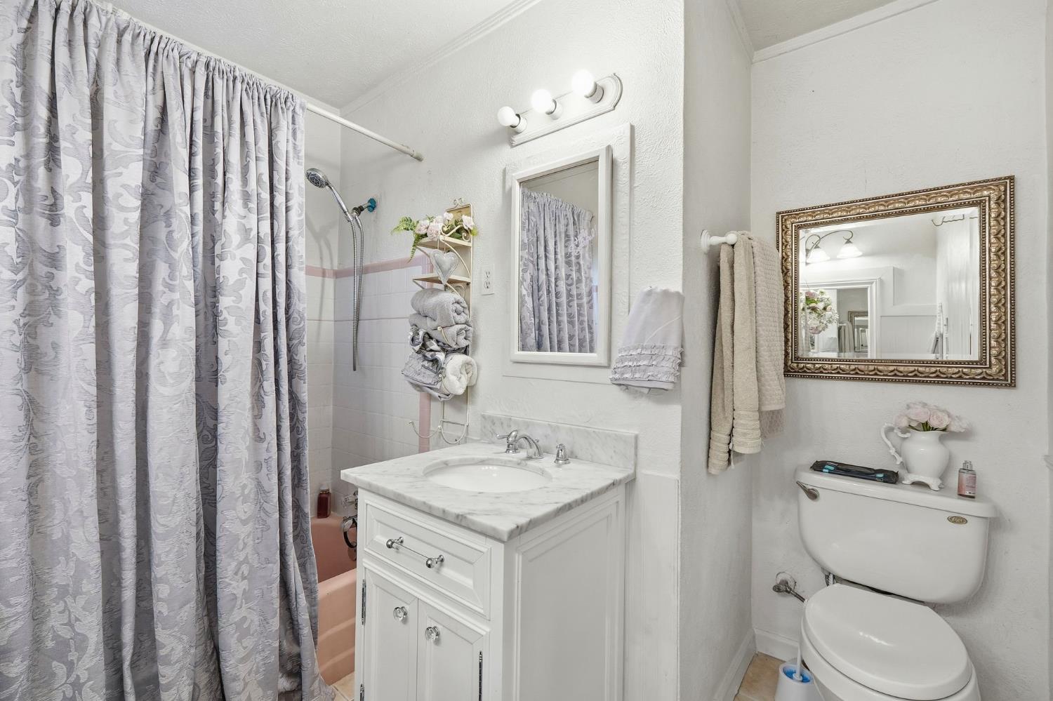 7801 El Modena Avenue Elverta, CA 95626 - Photo 26 of 51 a bathroom with a granite countertop sink toilet and shower