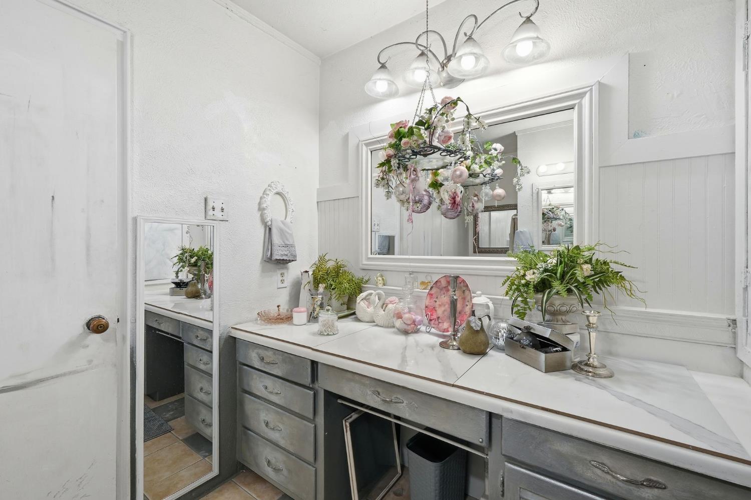 7801 El Modena Avenue Elverta, CA 95626 - Photo 27 of 51 a room with a vase of flowers sitting on a shelf