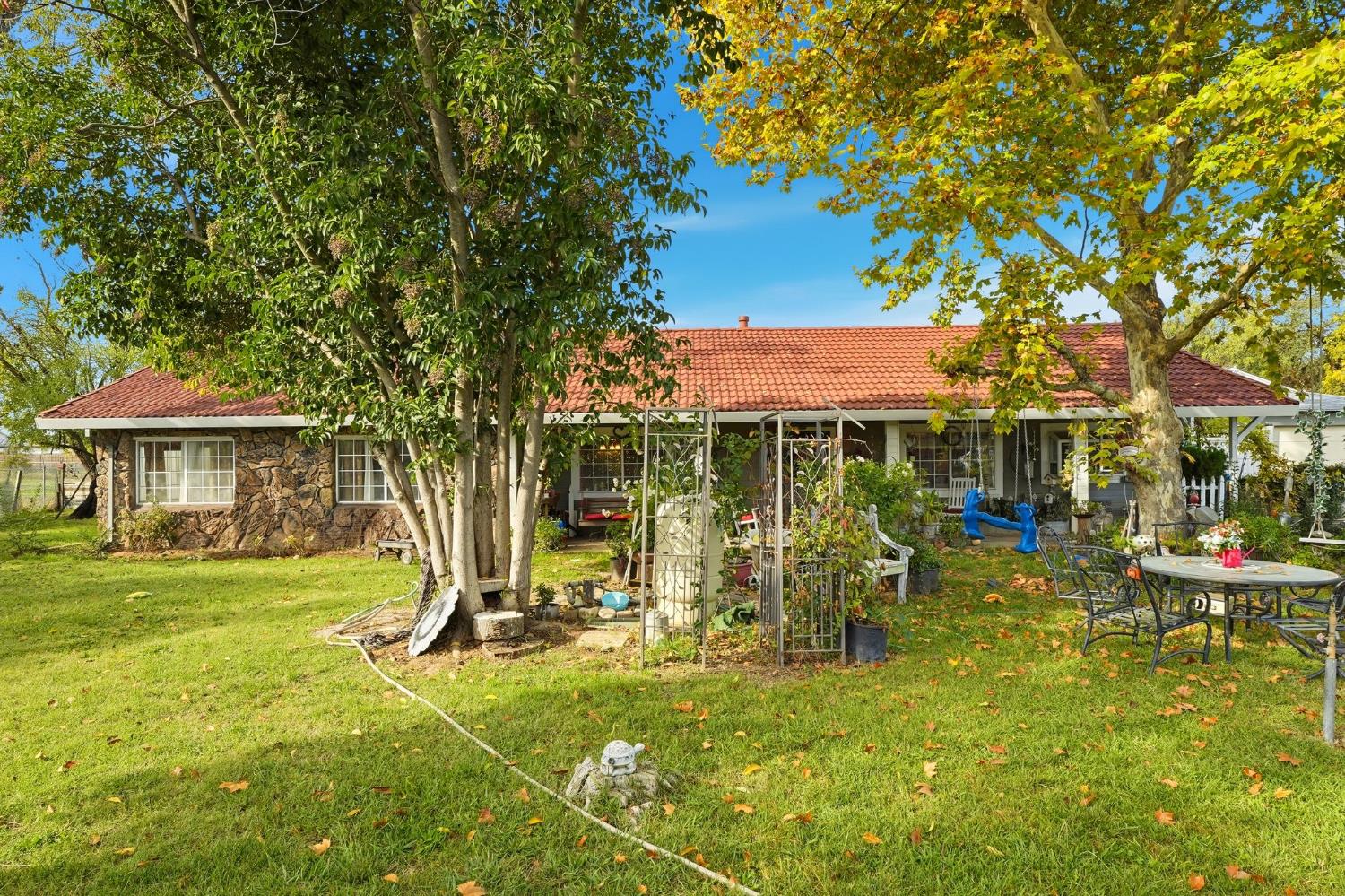 7801 El Modena Avenue Elverta, CA 95626 - Photo 30 of 51 a view of swimming pool with lawn chairs under an umbrella