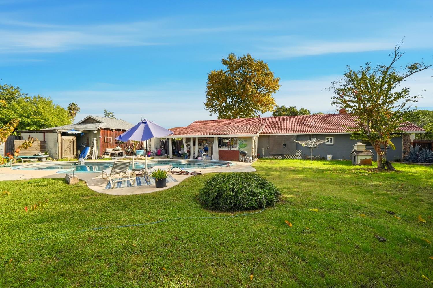 7801 El Modena Avenue Elverta, CA 95626 - Photo 40 of 51 a front view of a house with garden