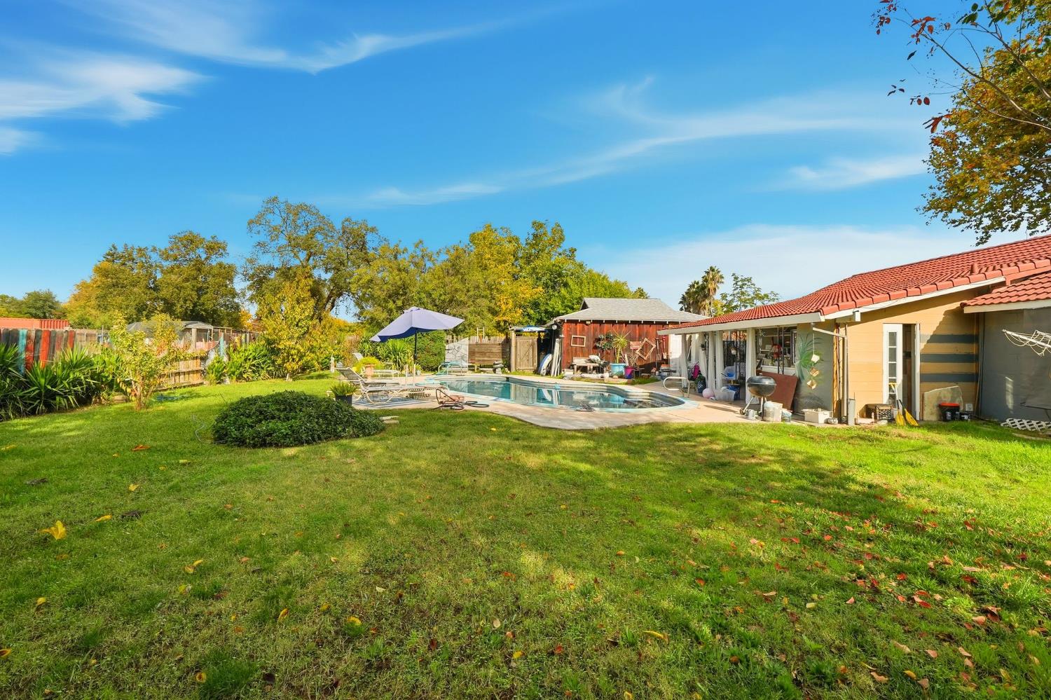 7801 El Modena Avenue Elverta, CA 95626 - Photo 41 of 51 a front view of a house with a garden