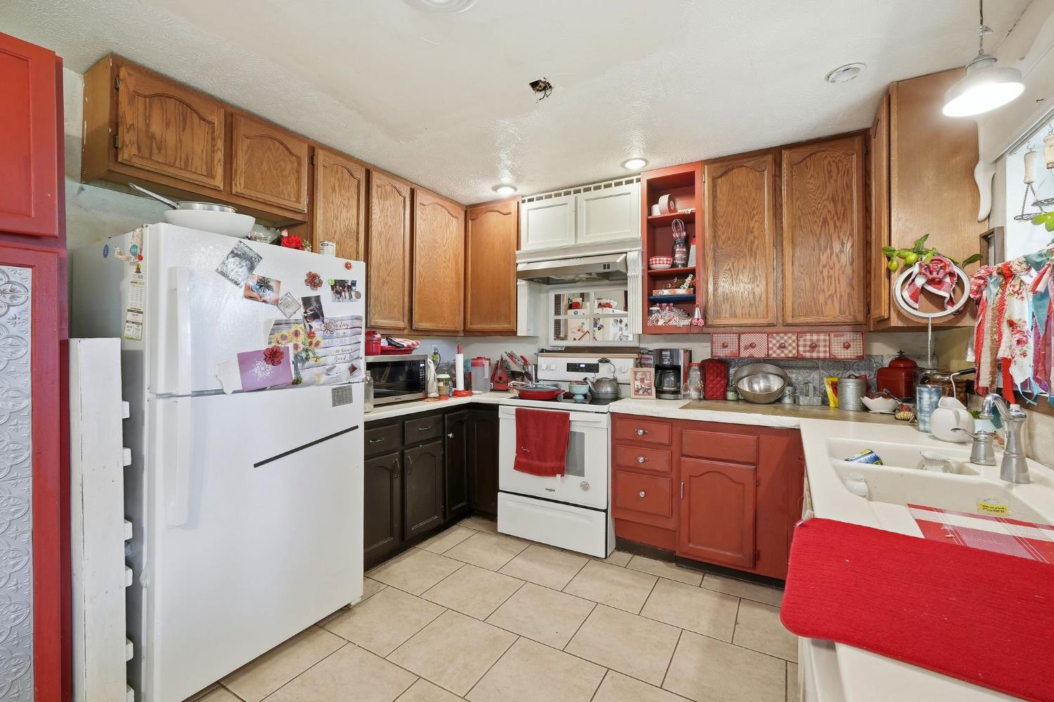 7801 El Modena Avenue Elverta, CA 95626 - Photo 7 of 51 a kitchen with stainless steel appliances granite countertop a refrigerator and a stove top oven