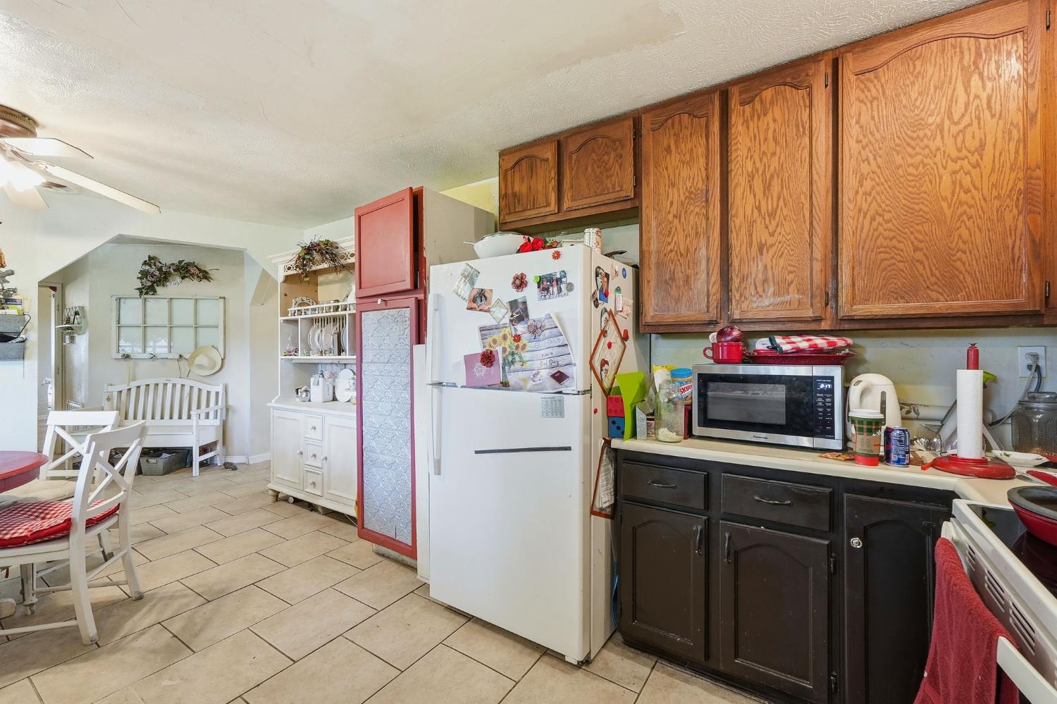 7801 El Modena Avenue Elverta, CA 95626 - Photo 8 of 51 a kitchen with stainless steel appliances a refrigerator sink and cabinets