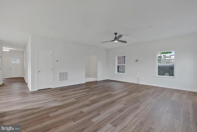 a kitchen with granite countertop a sink stainless steel appliances and cabinets