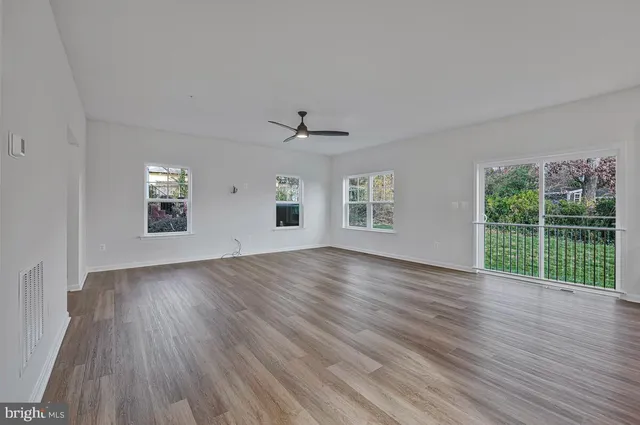 a view of kitchen with wooden floor and window