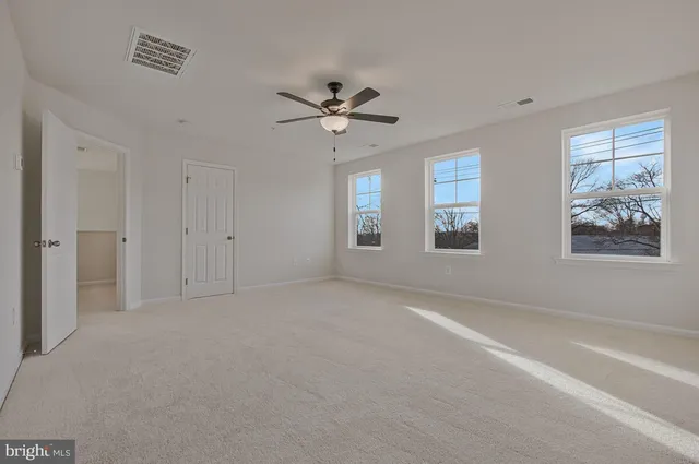 a view of a big room with carpet