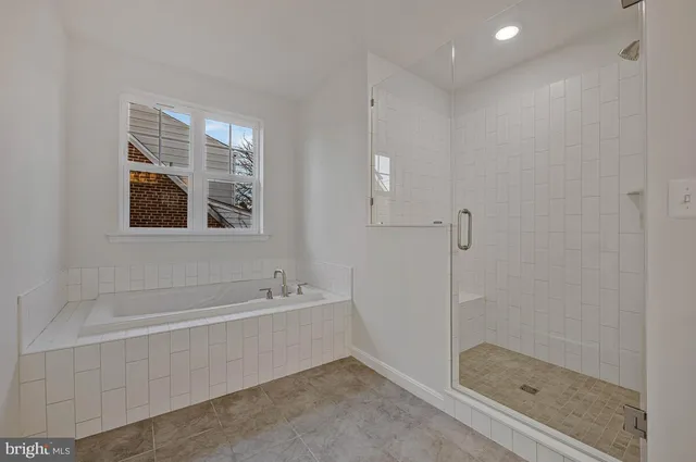 a bathroom with 2 sink toilet and a mirror