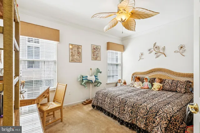 a bedroom with a bed chair and window