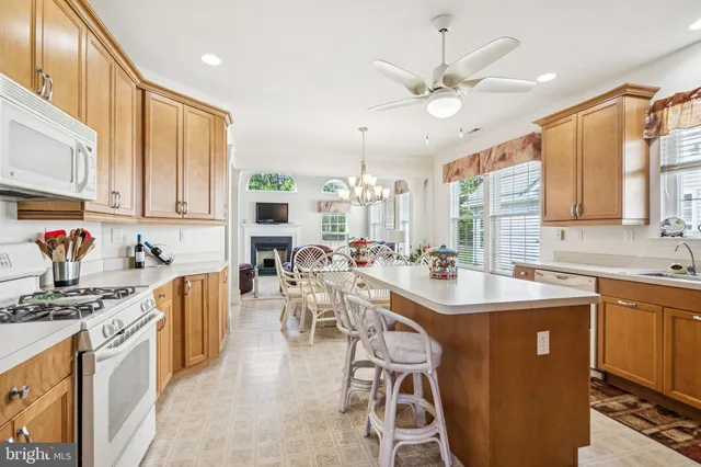 a kitchen with stainless steel appliances a stove a sink dishwasher and a refrigerator