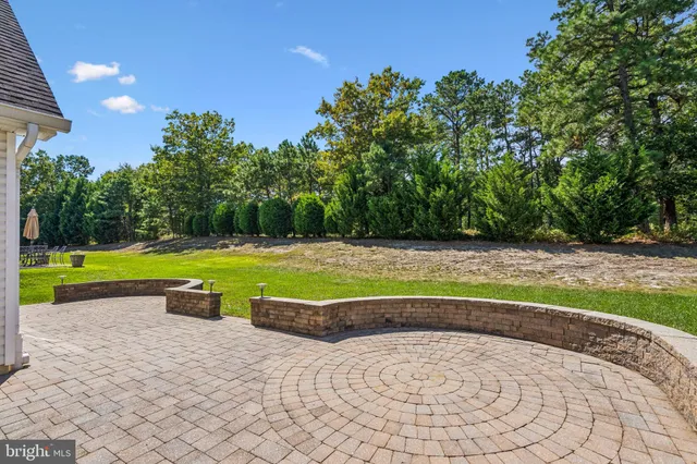 a view of swimming pool with a yard
