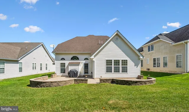 a front view of a house with a yard and porch